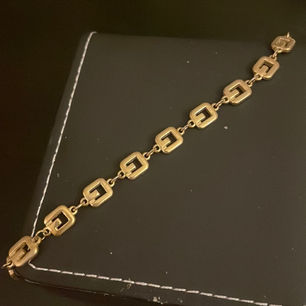 Givenshy yellow metal authentic braselet